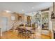Spacious kitchen area with an island, dining table, and staircase at 28 Rebellion Rd, Charleston, SC 29407