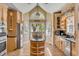 Bright kitchen features custom cabinets, stainless steel appliances, and a view of the outdoors at 28 Rebellion Rd, Charleston, SC 29407