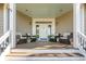 Inviting covered porch with comfortable seating, perfect for relaxing and enjoying the outdoors at 28 Rebellion Rd, Charleston, SC 29407