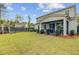 Spacious backyard showing a covered porch, a modern fence, and green landscaping for a private outdoor space at 2830 Backman St, Mount Pleasant, SC 29466