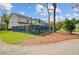 Well-maintained backyard with a modern fence, green lawn, mature trees, and tasteful landscaping at 2830 Backman St, Mount Pleasant, SC 29466