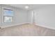 Bright bedroom with a ceiling fan, light neutral carpet, large window, and a door leading to the closet at 2830 Backman St, Mount Pleasant, SC 29466