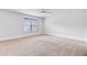 Bright bedroom with a window, neutral carpet and walls, and a ceiling fan at 2830 Backman St, Mount Pleasant, SC 29466