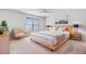 Comfortable bedroom with a queen bed, two windows with blinds, ceiling fan, and two nightstands at 2830 Backman St, Mount Pleasant, SC 29466