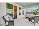 Relaxing covered patio featuring comfortable seating and seamless transition to the indoors through sliding glass doors at 2830 Backman St, Mount Pleasant, SC 29466