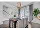 Well-lit dining room boasts elegant decor, stylish light fixtures, and ample natural light at 2830 Backman St, Mount Pleasant, SC 29466