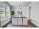 Dining room featuring a modern chandelier, large window, and sophisticated decor for elegant gatherings at 2830 Backman St, Mount Pleasant, SC 29466