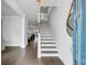 Bright foyer featuring wood floors, an elegant staircase, and a view into the adjacent living spaces at 2830 Backman St, Mount Pleasant, SC 29466