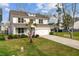 Charming two-story home featuring a manicured front lawn, covered porch, and attached two-car garage at 2830 Backman St, Mount Pleasant, SC 29466
