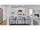Modern kitchen island featuring seating, sleek appliances, and a view into the living area at 2830 Backman St, Mount Pleasant, SC 29466