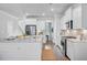 Open kitchen features an island with seating, stainless steel appliances, and modern cabinetry at 2830 Backman St, Mount Pleasant, SC 29466