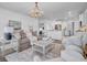 Open concept living area featuring hardwood floors, comfortable seating, and modern lighting at 2830 Backman St, Mount Pleasant, SC 29466