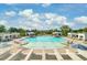 Large community pool with chairs and umbrellas surrounded by trees with cabanas nearby at 2830 Backman St, Mount Pleasant, SC 29466
