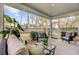 Inviting screened porch with cozy furniture and serene views of the landscaped backyard and neighborhood at 2830 Backman St, Mount Pleasant, SC 29466