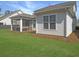 A screened in porch looks out to the backyard and surrounding trees at 2901 Backman St, Mount Pleasant, SC 29466