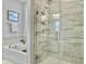 Modern bathroom featuring a glass-enclosed shower and soaking tub at 2901 Backman St, Mount Pleasant, SC 29466