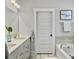 Bright bathroom with double sinks, modern fixtures, and a soaking tub at 2901 Backman St, Mount Pleasant, SC 29466
