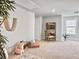 Spacious bonus room featuring a study nook, teepee, decorative ladder and wall art, and a seating area with stylish rug at 2901 Backman St, Mount Pleasant, SC 29466