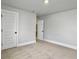 Bright bedroom featuring neutral carpet, white trim, and a paneled door at 2901 Backman St, Mount Pleasant, SC 29466