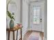 Inviting entryway with a wooden console table, round gold mirror, and a decorative rug near the front door at 2901 Backman St, Mount Pleasant, SC 29466