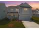 Inviting two-story home with a manicured lawn, captured at dusk for warm lighting at 2901 Backman St, Mount Pleasant, SC 29466