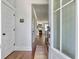 Inviting foyer with hardwood floors, leading to a cozy fireplace in the living area at 2901 Backman St, Mount Pleasant, SC 29466