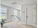 Well-lit hallway with staircase and a plant at 2901 Backman St, Mount Pleasant, SC 29466