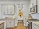Modern kitchen with stainless steel appliances, light cabinets, and functional built-in storage at 2901 Backman St, Mount Pleasant, SC 29466