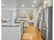 Bright kitchen with white cabinets, stainless steel appliances, subway tile backsplash, and hardwood flooring at 2901 Backman St, Mount Pleasant, SC 29466