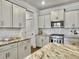Elegant kitchen with stainless steel appliances, granite countertops, white cabinets, and subway tile backsplash at 2901 Backman St, Mount Pleasant, SC 29466