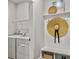 Bright mudroom with storage bench, decorative hat and wall decor, adjacent to laundry machines at 2901 Backman St, Mount Pleasant, SC 29466