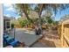 Large backyard with mature trees, wooden deck, fenced perimeter, and covered grill area at 2940 Amberhill Way, Charleston, SC 29414