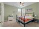 Bedroom with a wrought iron bed frame, neutral carpet, and dual windows for natural light at 2940 Amberhill Way, Charleston, SC 29414
