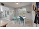 Cozy breakfast nook features a white table with colorful seating and views of the backyard at 2940 Amberhill Way, Charleston, SC 29414