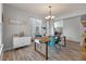 Bright dining area featuring an elegant chandelier and modern furnishings at 2940 Amberhill Way, Charleston, SC 29414