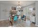 Bright dining room with a dining table, colorful chairs, and natural light at 2940 Amberhill Way, Charleston, SC 29414