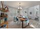 Bright dining area with elegant lighting and views of the front yard at 2940 Amberhill Way, Charleston, SC 29414