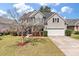 Charming two-story home with a well-manicured lawn and attached garage at 2940 Amberhill Way, Charleston, SC 29414