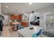 Open kitchen with stainless steel appliances, central island, and adjacent dining area at 2940 Amberhill Way, Charleston, SC 29414