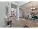 Open-concept living space with high ceilings and wood-look floors at 2940 Amberhill Way, Charleston, SC 29414