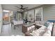 Sunroom with tile floor, ceiling fan, wicker furniture, and view of backyard at 2940 Amberhill Way, Charleston, SC 29414