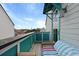 Inviting balcony featuring turquoise accents, comfortable seating, and views of the surrounding neighborhood at 3 1/2 Maranda Holmes St # B, Charleston, SC 29403