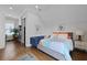 Cozy bedroom boasts a comfortable bed, sitting area, and access to a separate desk area at 3 1/2 Maranda Holmes St # B, Charleston, SC 29403