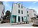 Three-story home featuring a gray roof and siding, with decorative turquoise trim on the front porch area at 3 1/2 Maranda Holmes St # B, Charleston, SC 29403