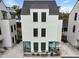 Three-story home featuring a gray roof and siding, with decorative turquoise trim on the front porch area at 3 1/2 Maranda Holmes St # B, Charleston, SC 29403