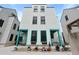 Three-story home featuring a gray roof and siding, with decorative turquoise trim on the front porch area at 3 1/2 Maranda Holmes St # B, Charleston, SC 29403