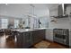 Modern kitchen features a waterfall countertop, stainless steel appliances, and lots of light at 3 1/2 Maranda Holmes St # B, Charleston, SC 29403