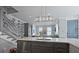 Open concept kitchen with island seating and stainless steel dishwasher at 3 1/2 Maranda Holmes St # B, Charleston, SC 29403