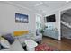 Cozy living room featuring hardwood floors, gray walls, modern furniture, and a decorative cabinet at 3 1/2 Maranda Holmes St # B, Charleston, SC 29403