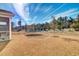 A backyard with a trampoline and space to run around at 307 Blue Oak Dr, Moncks Corner, SC 29461